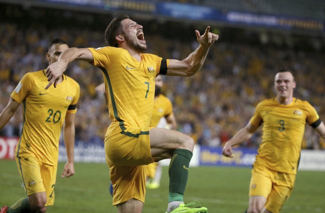 Australia's Mathew Leckie, center, celebrates scoring against the United Arab Emirates during their world Cup qualifying soccer match in Sydney, Tuesday, March 28, 2017. (AP Photo/Rick Rycroft). Picture: Rick Rycroft