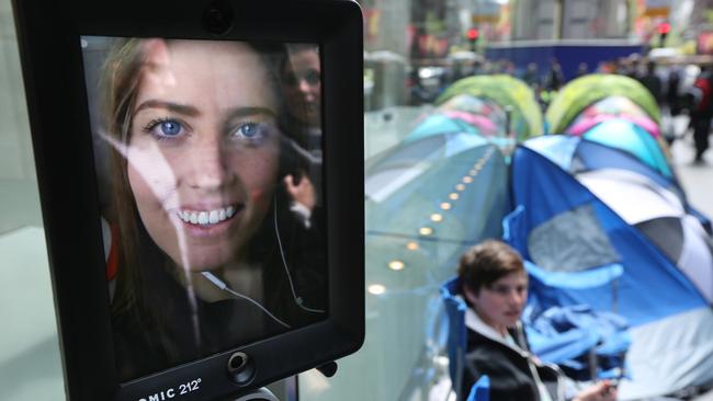 Lucy the robot was first in line. People waiting outside the Apple store in George St for the iPhone 6S. Photo: Bob Barker.