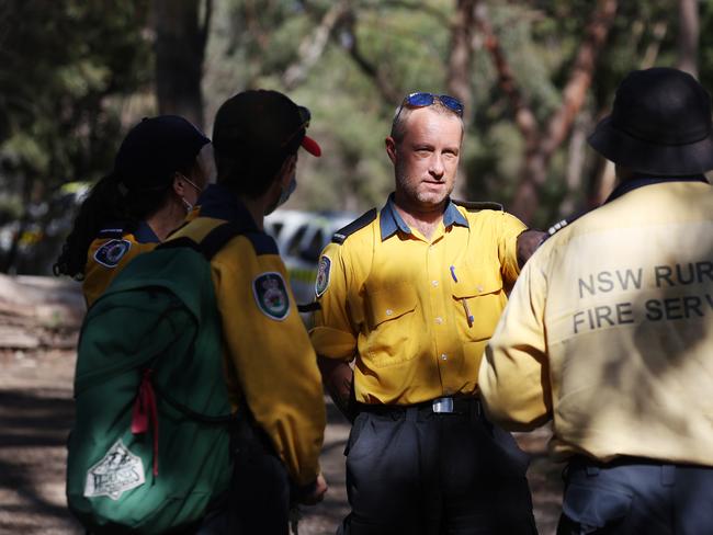 RFS members scouring the place where the girl went missing. Picture: David Swift