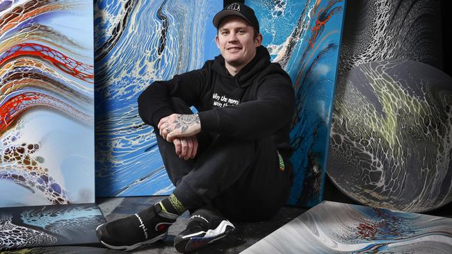 Dayne Beams surrounded by some of his artwork at his Health of Mind Art studio. Picture: David Caird