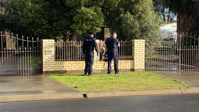 Police return to the scene of a shooting at Munno Para West.