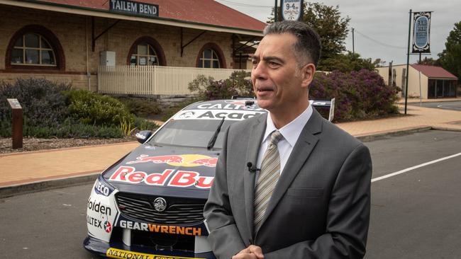 Managing Director of The Bend Motorsport Park Dr. Sam Shahin in front of the Red Bull Holden Racing car at the Tailem Rail Museum. Picture: Brad Fleet