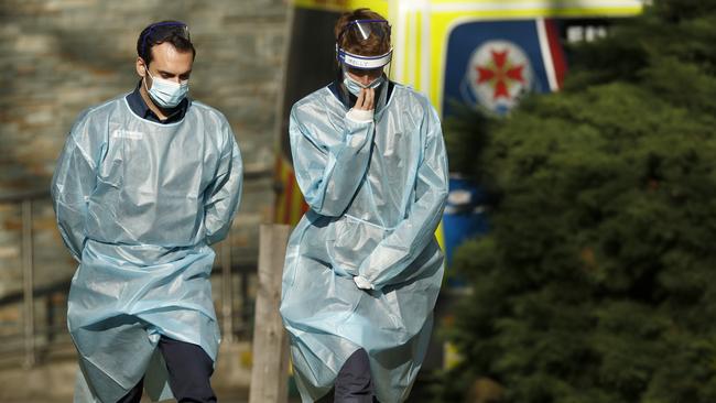 Paramedics outside the North Melbourne public housing towers. Picture: Getty