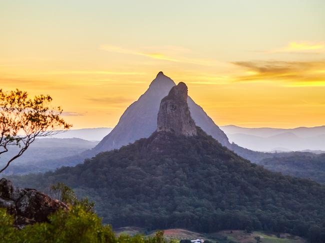 Glasshouse Mountains,Sunshine Coast Hinterlands,Queensland,Australia. Sunset behind Mt Coonowrin and Mt Beerwah,Photo - GettyESCAPE 26 June 2022Life in Travel Birrunga