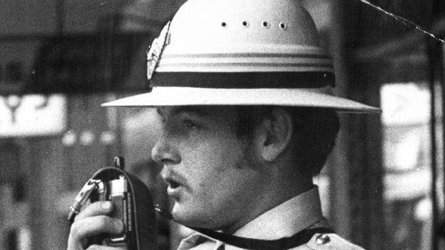 Pith helmets were part of the Victoria Police summer uniform, as modelled by Constable David Shawyer in Smith Street, Collingwood in December 1973. Picture: Herald Sun