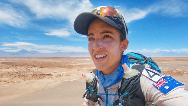 Jacqui Bell takes a photo during a run through San Pedro de Atacama, Chile.