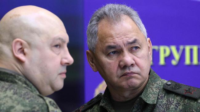 Russian General Sergei Surovikin, left, commander of Russia's military operation in Ukraine and Russian Defence Minister Sergei Shoigu at a meeting with Vladimir Putin on Friday. Picture: Sputnik / AFP