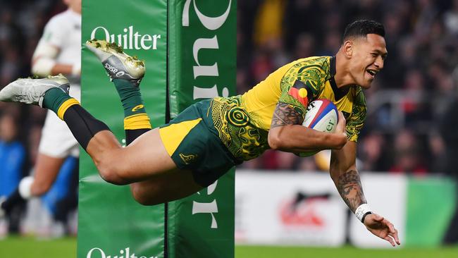 (FILES) In this file photo taken on November 24, 2018 Australia's full-back Israel Folau scores a try during the international rugby union test match between England and Australia at Twickenham stadium in south-west London. - Israel Folau has requested a code of conduct hearing, Rugby Australia said on April 17, 2019 after the governing body moved to sack the star Wallabies fullback over anti-gay comments. (Photo by Ben STANSALL / AFP)