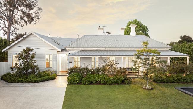 The extension continues the classic style of the original 1871 residence.