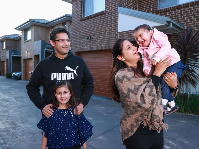 Gaurav and Kanika Bakshi Thind, with their children, Sara, 8, and Ayra, 13 months, at Quakers Hill on Tuesday. The family are struggling because they are renting while waiting for their home to be built which they bought before the rate hike. Picture: Justin Lloyd