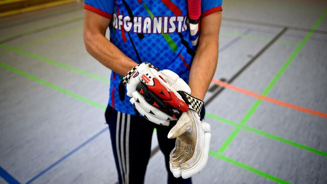 An Afghan refugee takes part in a cricket training session at Essen, western Germany, in 2016. Picture: AFP