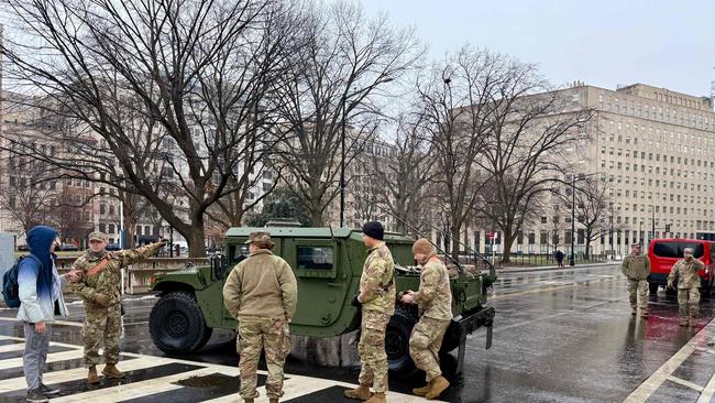 US National Guard soldiers block a street in Washington, DC, on January 19, 2025, as the US capital prepares for the inauguration of US President-elect Donald Trump on January 20. (Photo by Daniel SLIM / AFP)