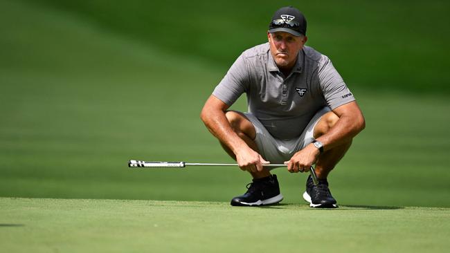 (FILES) Phil Mickelson of the United States line up a putt on the 11th green during day one of the LIV Golf Invitational – Greenbrier at The Old White Course on August 04, 2023 in White Sulphur Springs, West Virginia. Phil Mickelson has placed bets worth a total of more than $1 billion during his career, including a $400,000 wager on the outcome of the 2012 Ryder Cup, according to excerpts from a forthcoming book published in US media on August 10, 2023. (Photo by Eakin Howard / GETTY IMAGES NORTH AMERICA / AFP)