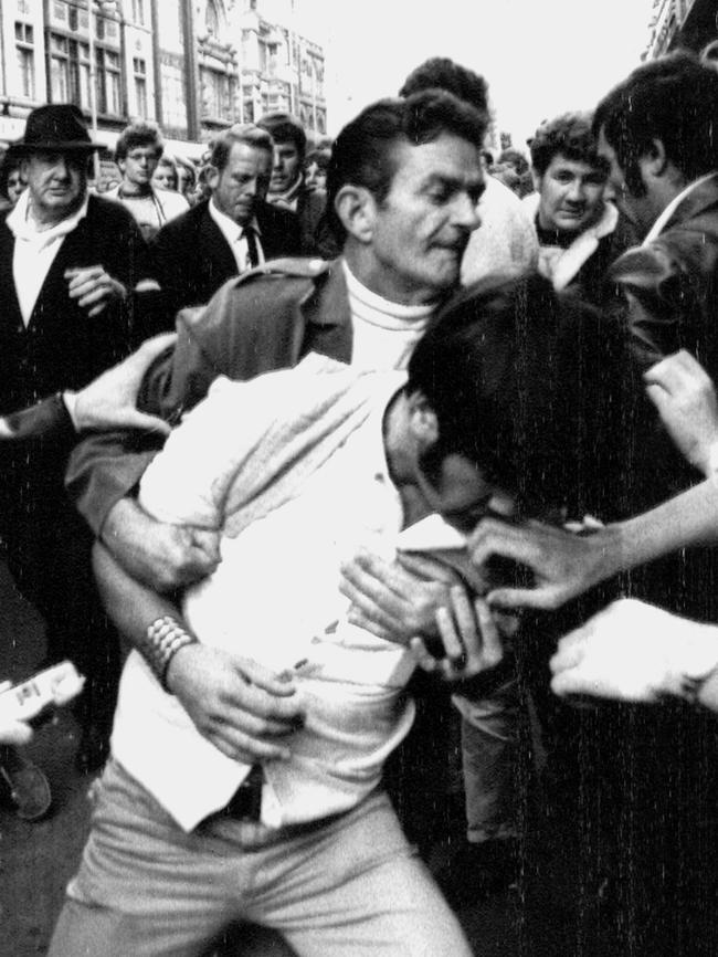 A Vietnam War supporter clashes with a protester. Picture: Herald Sun