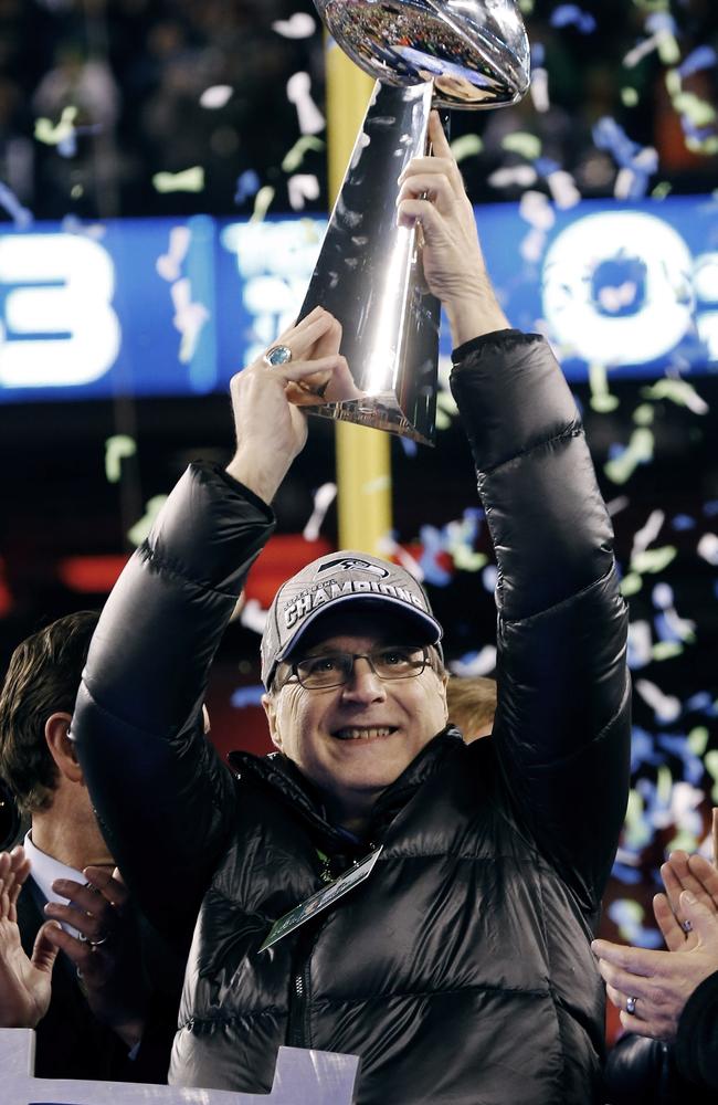 Paul Allen, pictured in 2014, holds the NFL Super Bowl trophy after the Seahawks’ victory. Picture: AP