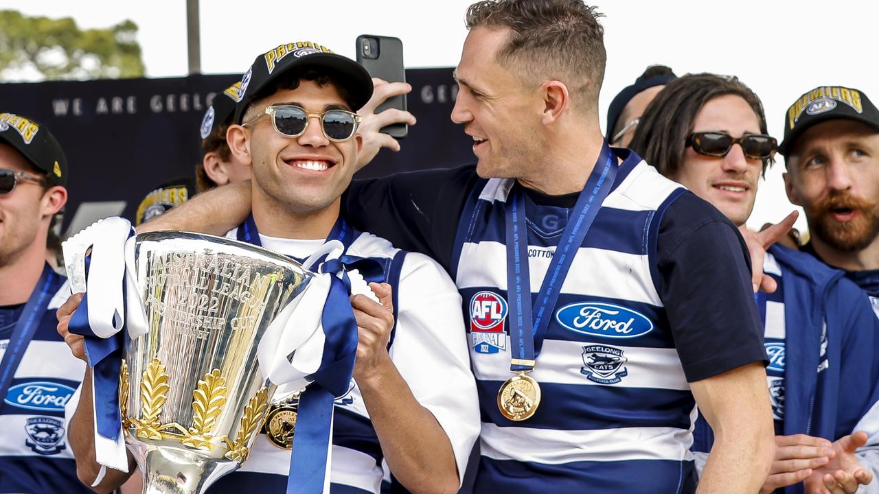 Tyson Stengle and Joel Selwood players are presented on stage during their celebrations