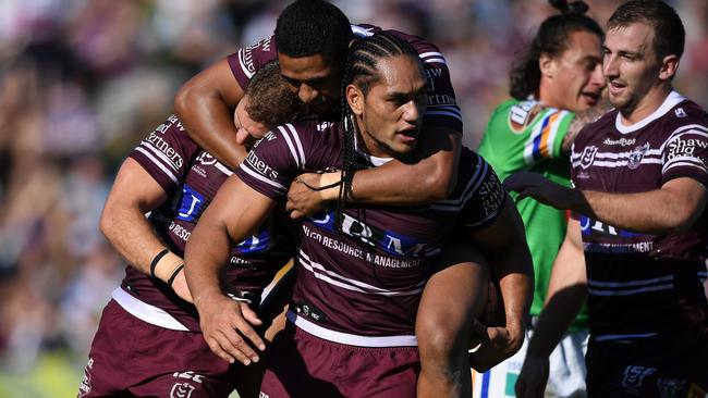 Martin Taupau celebrates a try with his Manly teammates. Picture: AAP