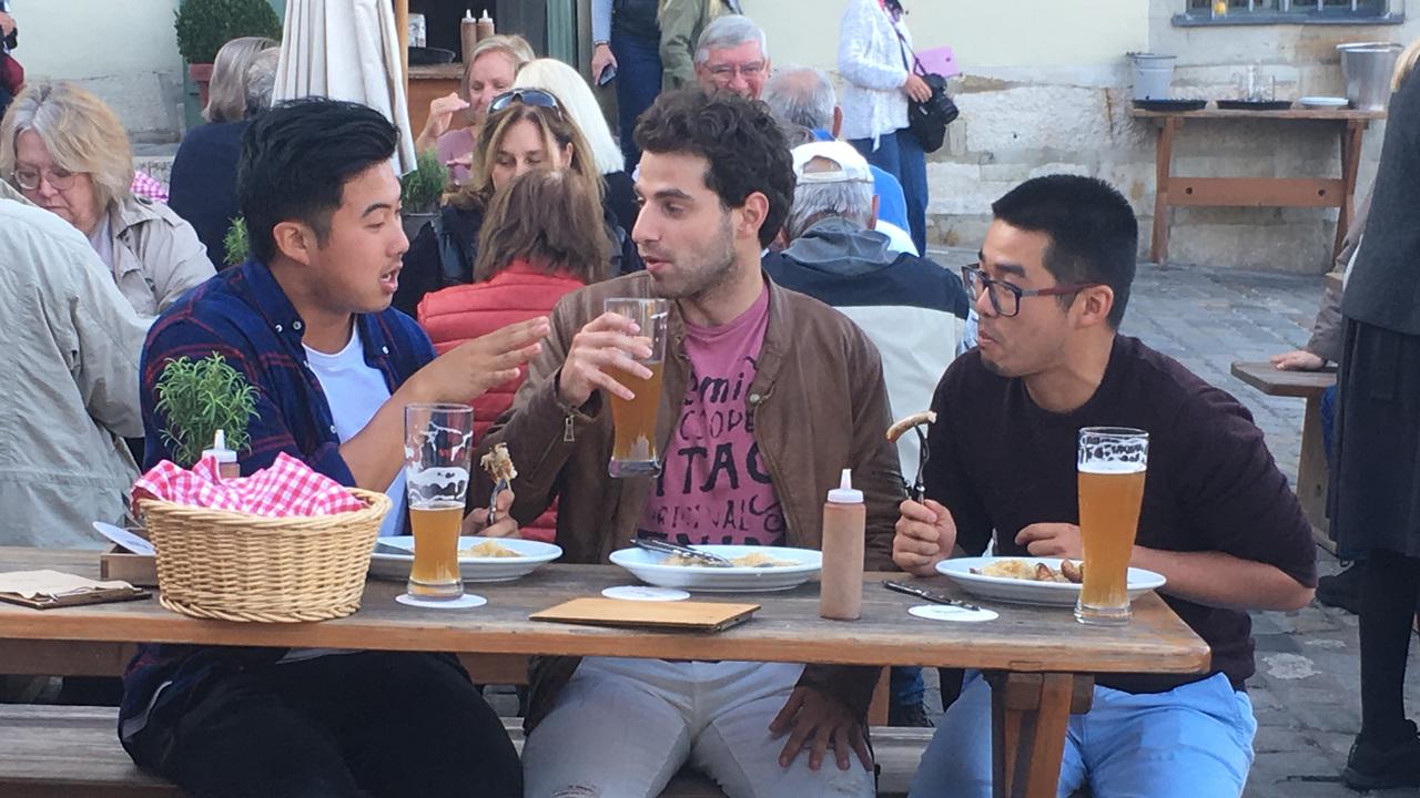 Kev, Dorian and Teng embrace the culture in Germany. Picture: Channel 9