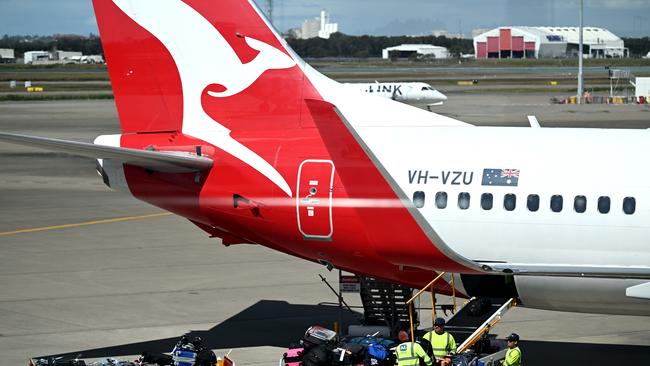 BRISBANE, AUSTRALIA - NewsWire Photos - AUGUST 11, 2022. Qantas baggage handlers at work at Brisbane airport. Industrial action will start at Qantas and budget offshoot Jetstar by the end of August amid an escalating fight over pay with its licensed engineers.Picture: NCA NewsWire / Dan Peled