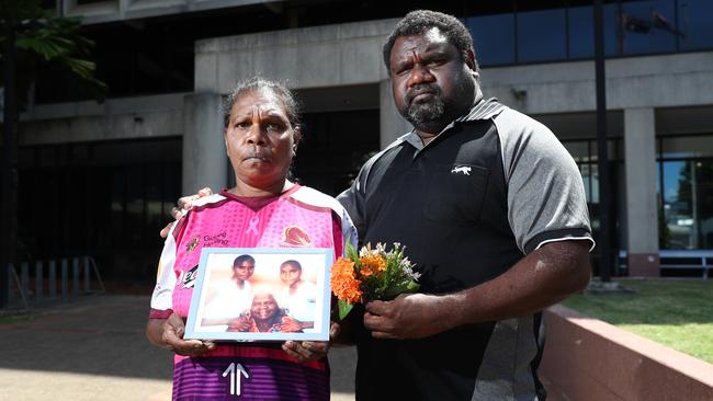 Ms Bernard's mother and uncle Edwina Bernard and Teddy Bernard, pictured with a photo of Ms Bernard (left) with her grandmother and sister. The pair were in the Cairns Coroner's Court on the first day of the coronial inquest into Ms Bernard’s disappearance. Picture: Brendan Radke