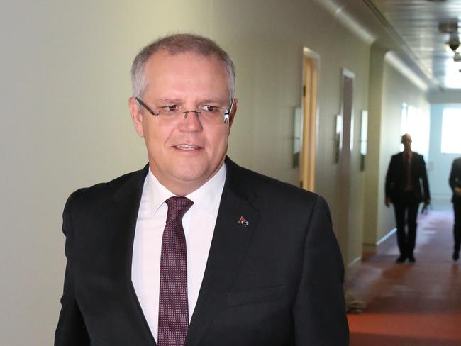 Treasurer Scott Morrison walks to Ch9 studios at Parliament House in Canberra this morning to be interviewed by Laurie Oaks. Picture: Ray Strange.