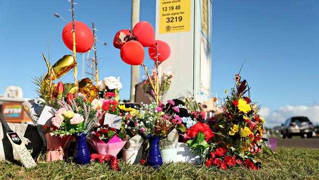 Flowers at the corner of Bayswater Rd and Duckworth St, Garbutt, in Townsville, where the crash happened. Picture: Alix Sweeney