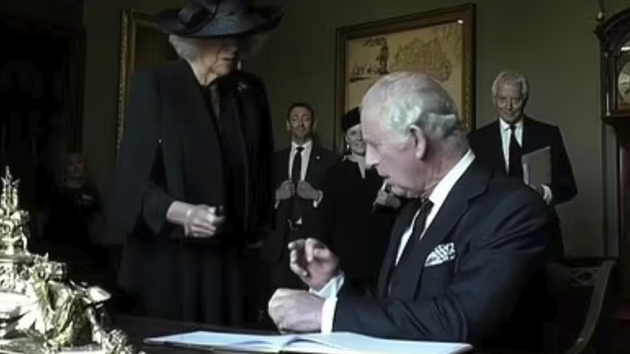 King Charles gets frustrated at a fountain pen leaking on his fingers while signing the guest book at Hillsborough Castle, Northern Ireland. Supplied