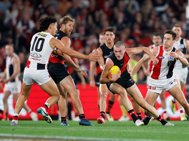 MELBOURNE, AUSTRALIA - MARCH 30: Nik Cox of the Bombers in action during the 2024 AFL Round 03 match between the Essendon Bombers and the St Kilda Saints at Marvel Stadium on March 30, 2024 in Melbourne, Australia. (Photo by Dylan Burns/AFL Photos via Getty Images)