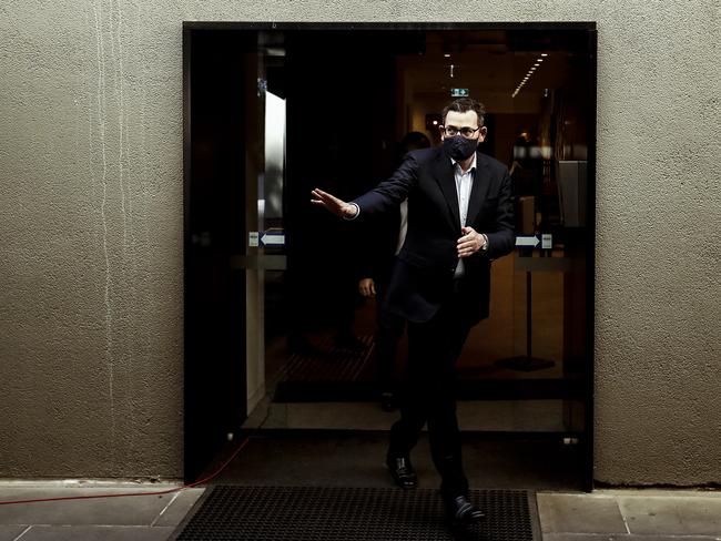 MELBOURNE, AUSTRALIA - AUGUST 02: Victorian Premier Daniel Andrews leaves the press conference on August 02, 2020 in Melbourne, Australia. Victorian Premier Daniel Andrews has announced a 'State of Disaster' and increased restrictions for Victoria. The Premier announced that 671 new cases of COVID were detected, 73 connected to outbreaks, 598 under investigation and seven people died overnight. Stage 3 restrictions will be reintroduced to regional Victoria.  An 8pm to 5am curfew will be introduced starting today. (Photo by Darrian Traynor/Getty Images)