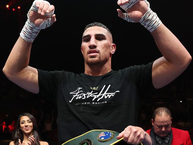 SYDNEY, AUSTRALIA - JUNE 16: Justis Huni celebrates winning his Australian heavyweight title fight against Paul Gallen at ICC Sydney on June 16, 2021 in Sydney, Australia.  (Photo by Cameron Spencer/Getty Images)