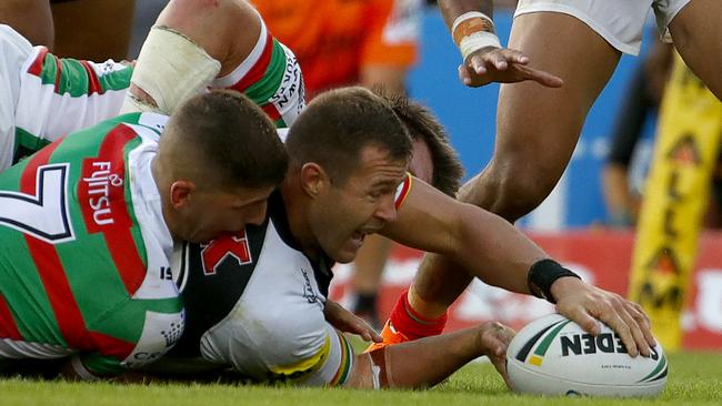 Trent Merrin crosses for a try.