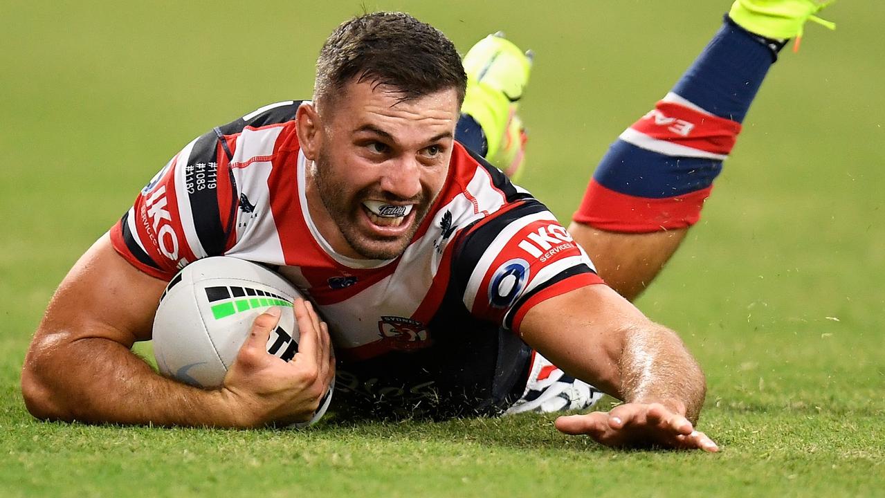 TOWNSVILLE, AUSTRALIA - SEPTEMBER 11: James Tedesco of the Roosters scores a try during the NRL Elimination Final match between Sydney Roosters and Gold Coast Titans at QCB Stadium, on September 11, 2021, in Townsville, Australia. (Photo by Ian Hitchcock/Getty Images)