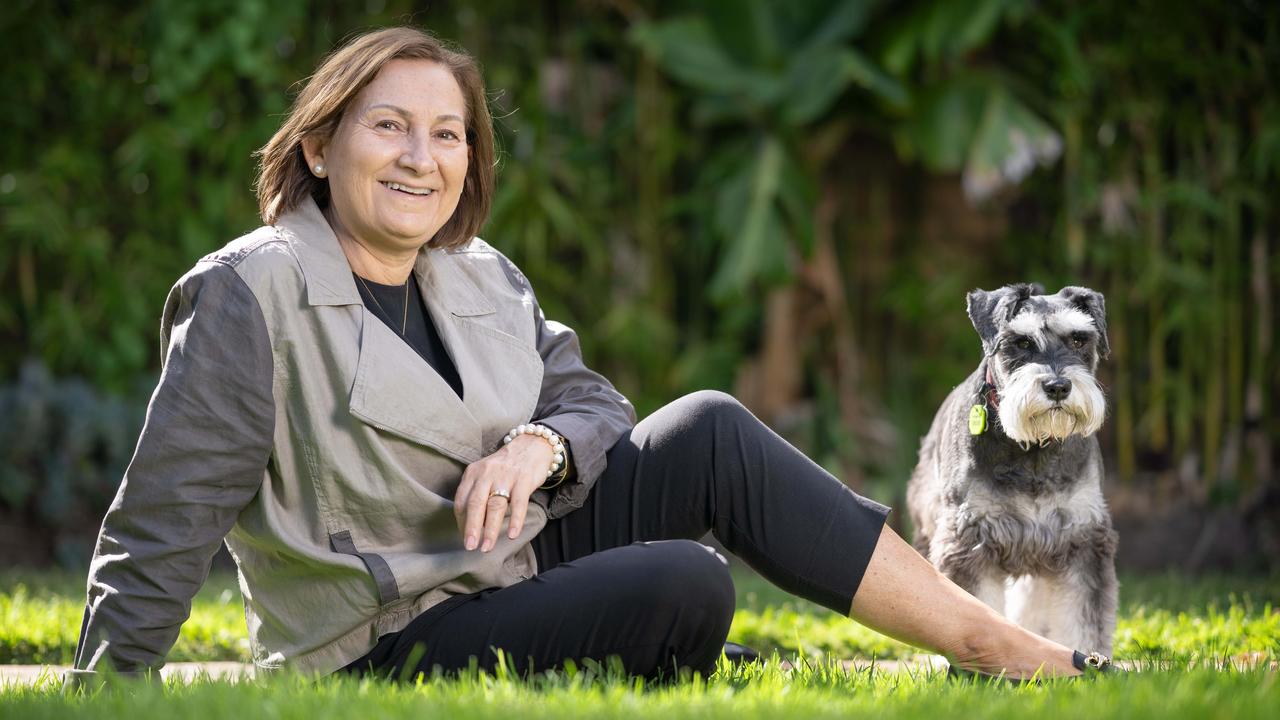 Former principal Pitsa Binnion, with her dog Raz, says it’s a difficult job because the issues principals often have to carefully manage really matter. Picture: Tony Gough