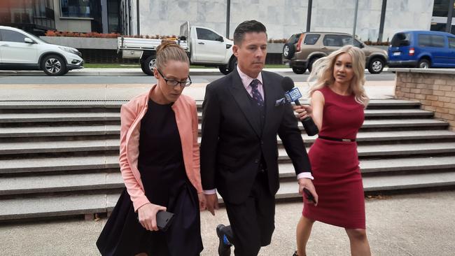 Ben Aulich, 47, and Bridie Harders, 35, leave the ACT Magistrates Court. They deny allegations they have been involved in organised crime. Picture: Craig Dunlop