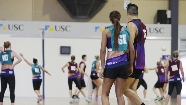 Geva Mentor stands next to the 215cm ‘Gentle Giant’ Junior Levi during a practice match. Picture: Lachie Millard