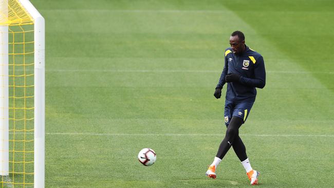 It’s a goal … Usain Bolt taps one in at Mariners training Picture: Brett Costello