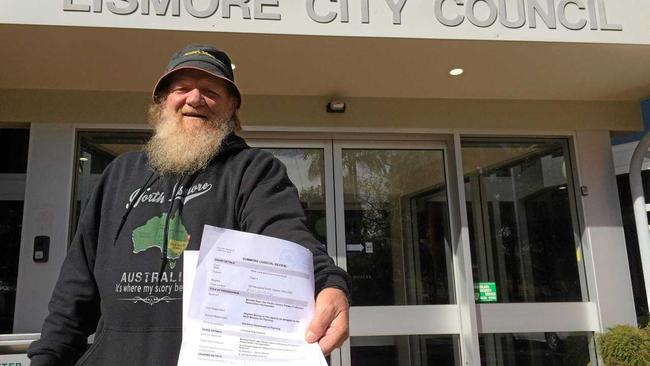 Bundjalung elder Michael Ryan delivering a NSW Land and Environment Court Summons on the Lismore City Council. Picture: Leah White