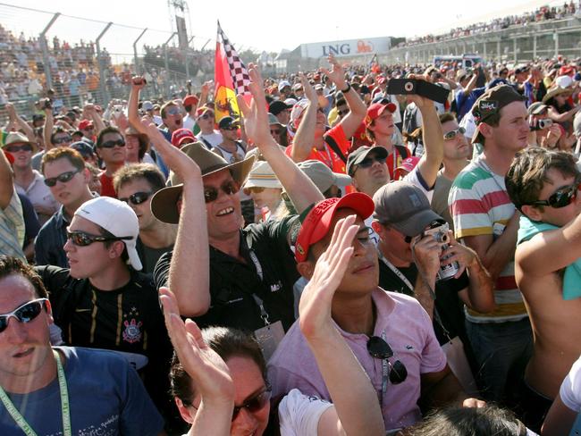 Melbourne Grand Prix Day 4. Fans crowd the track after the finish.