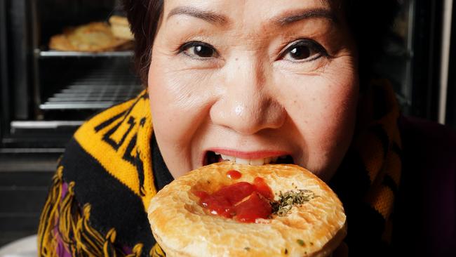 Trieu Tran tucks into a pie at Richmond Pie Shop. Picture: Nicole Cleary