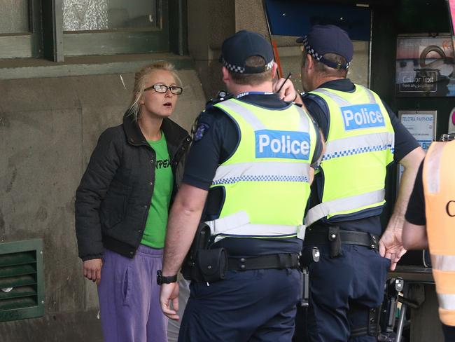 Police speak with people near the homeless camp outside Flinders Street Station on Thursday, January 19, 2017, in Melbourne, Victoria, Australia. Picture: Hamish Blair