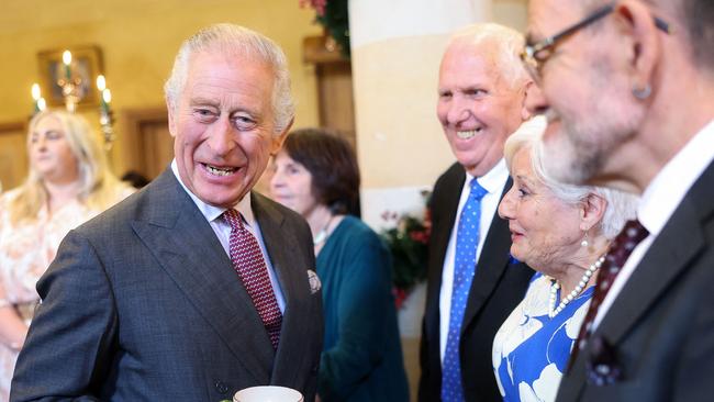 Britain's King Charles III reacts whilst holding a cup and saucer, as he meets with guests during a 75th birthday party for him, hosted by the Prince's Foundation, at Highgrove House in Tetbury, western England on November 13, 2023. Guests included local residents who have been nominated by friends and family and individuals and organisations also turning 75 in 2023. (Photo by Chris Jackson / POOL / AFP)