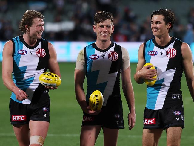 ADELAIDE, AUSTRALIA - AUGUST 13: Xavier Duursma, Zak Butters and Connor Rozee of the Power after their win during the 2023 AFL Round 22 match between the Port Adelaide Power and the GWS GIANTS at Adelaide Oval on August 13, 2023 in Adelaide, Australia. (Photo by James Elsby/AFL Photos via Getty Images)