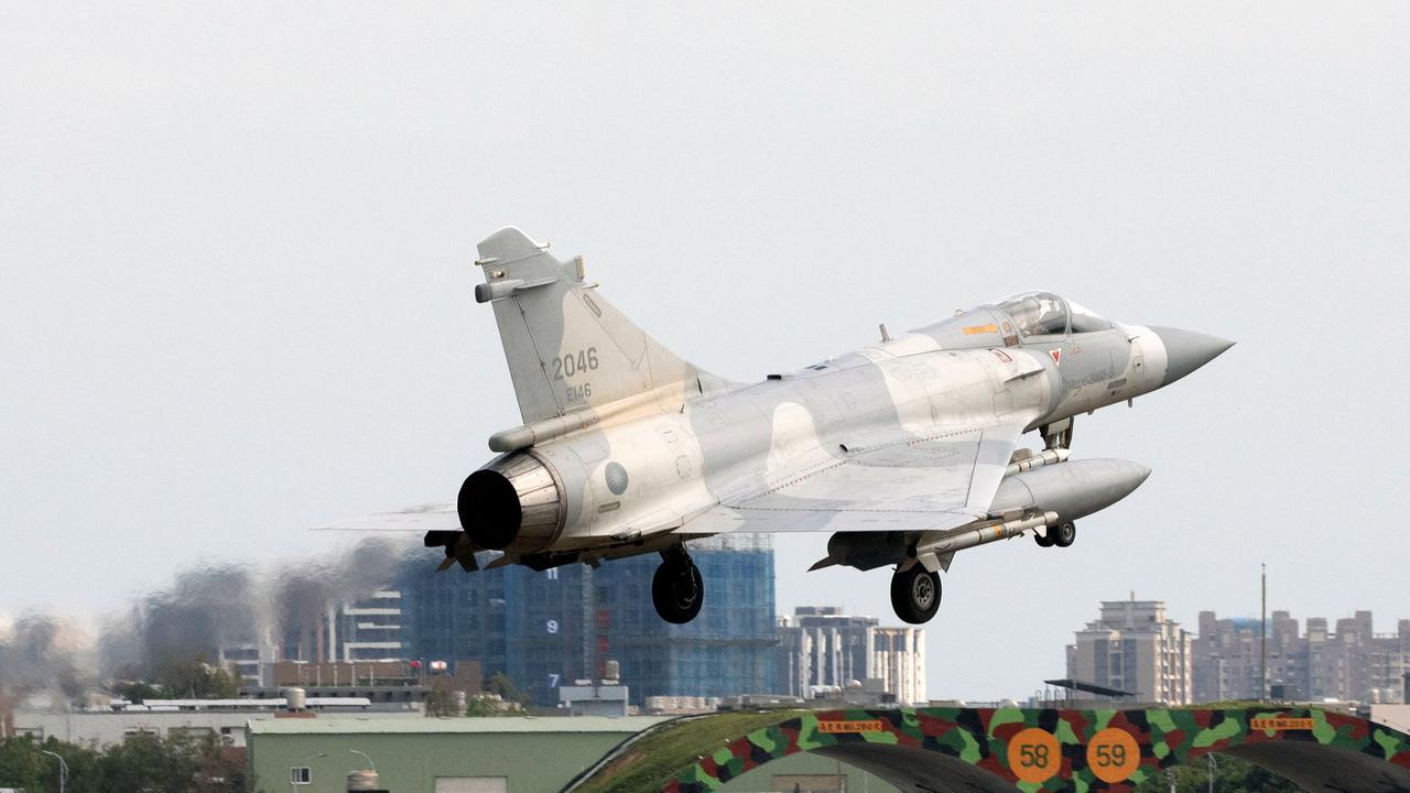 A Taiwanese air force Mirage 2000 fighter jet lands at an air force base in Hsinchu, northern Taiwan on Sunday. China was conducting a second day of military drills around Taiwan. Picture: Jameson Wu/AFP