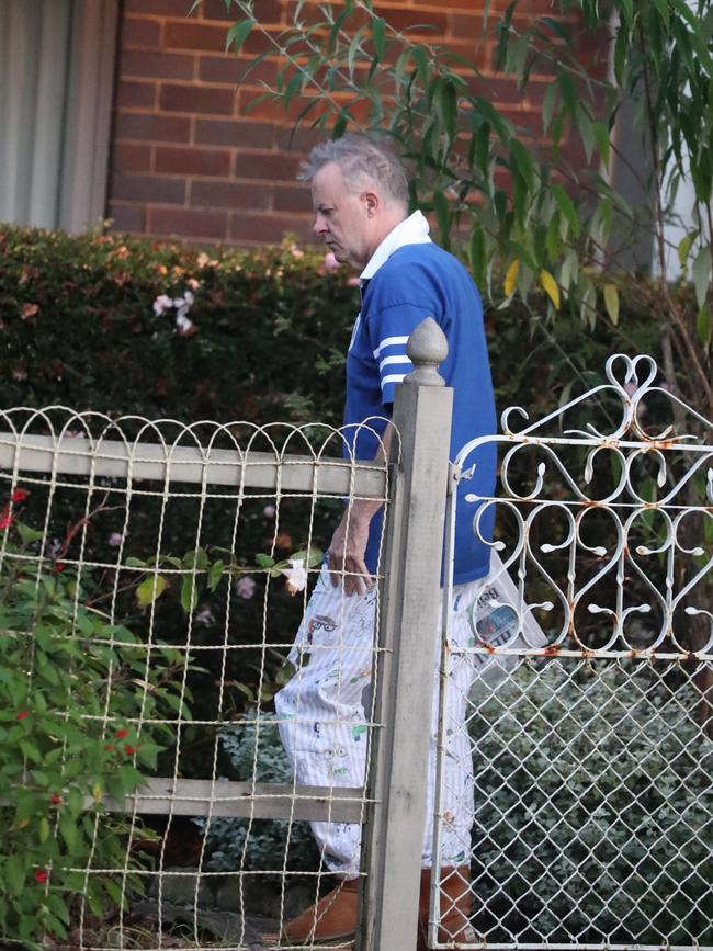 seen picking up his morning paper from his front porch. Picture: John Grainger