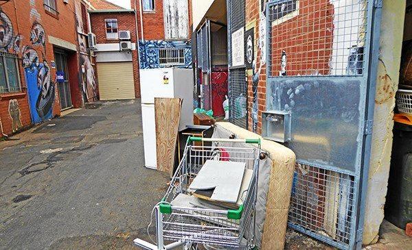 Dumping in Eggins Lane in the middle of the Lismore CBD is commonplace. Image 2 (below): The sign Council will begin placing in public areas where people are dumping to advise them fines apply. Picture: Lismore City Council