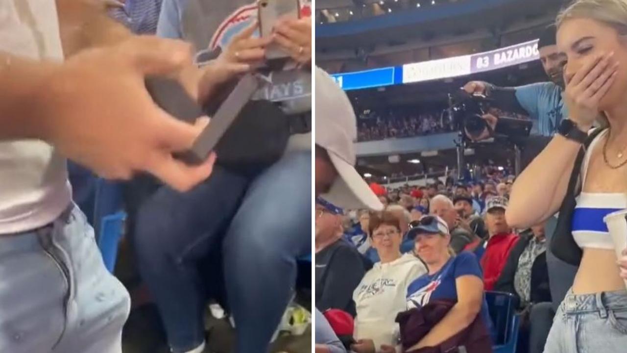 RED SOX FAN AWKWARDLY PROPOSES TO GIRL FRIEND