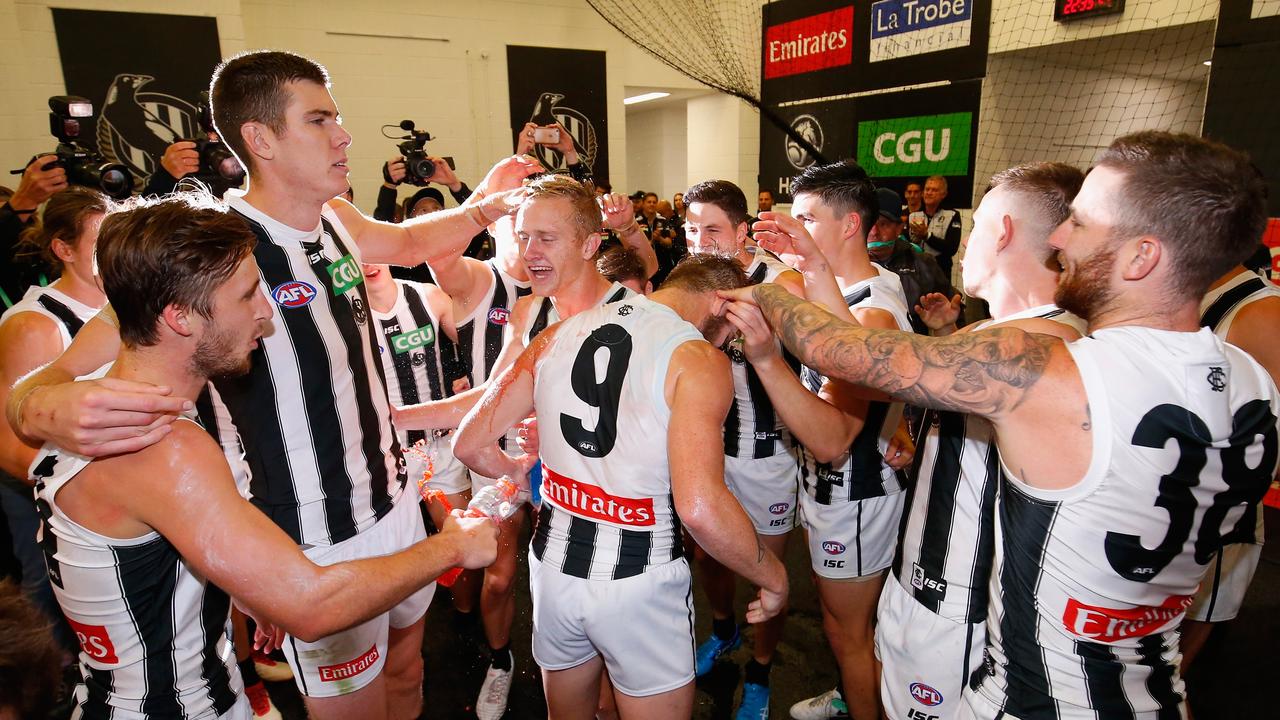 MELBOURNE, AUSTRALIA — APRIL 06: Collingwood players sing the team song after the round three AFL match between the Carlton Blues and the Collingwood Magpies at Melbourne Cricket Ground on April 6, 2018 in Melbourne, Australia. (Photo by Darrian Traynor/Getty Images)