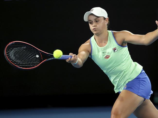 Australia's Ashleigh Barty makes a forehand return to Lesia Tsurenko of Ukraine during their first round singles match at the Australian Open tennis championship in Melbourne, Australia, Monday, Jan. 20, 2020. (AP Photo/Lee Jin-man)