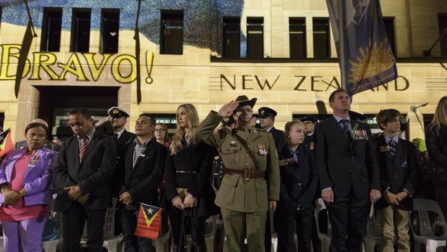 Servicemen and woman, veterans and civilians pause together to remember the fallen this morning at the Martin Place dawn service. Picture: John Grainger