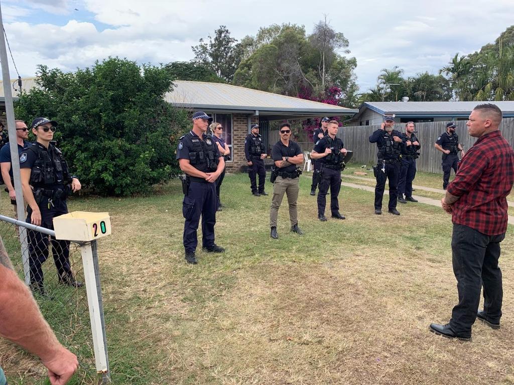 Police guarding a home in Norman Gardens as part of the anti-crime rally.